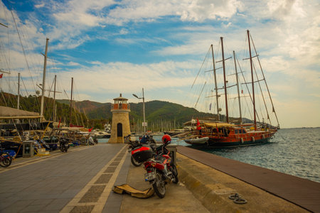 MARMARIS, MUGLA, TURKEY: View of the lighthouse at the berth of ships and yachts in Marmaris on a cloudy day.のeditorial素材