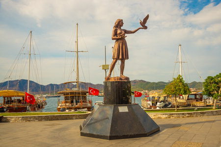 MARMARIS, MUGLA, TURKEY: Woman statue in Marmaris port holding a pigeon in Marmaris.のeditorial素材