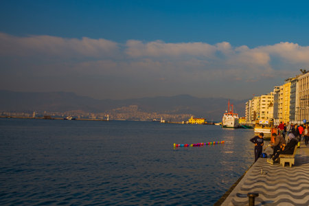 IZMIR, TURKEY: Promenade with sea view and traditional pattern on the road in Izmir on a cloudy day.のeditorial素材