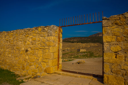PAMUKKALE, DENIZLI, TURKEY: View of the Pamukkale Amphitheater, the ruined city of Hierapolis.のeditorial素材