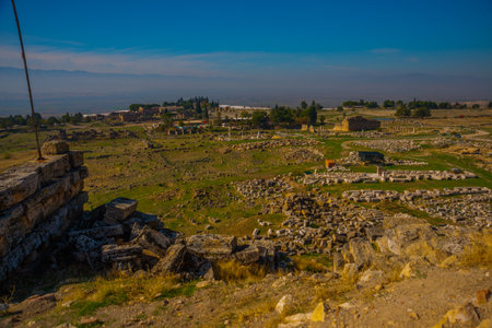 PAMUKKALE, DENIZLI, TURKEY: Ruins of the ruined city of Hierapolis in Pamukkale on a sunny day.のeditorial素材