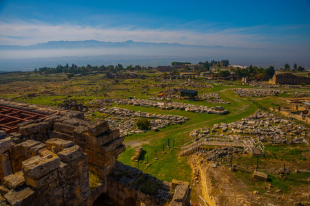 PAMUKKALE, DENIZLI, TURKEY: Ruins of the ruined city of Hierapolis in Pamukkale on a sunny day.のeditorial素材