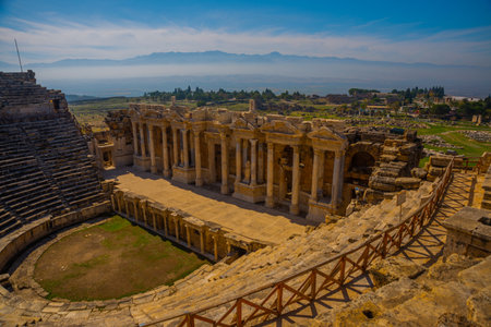 PAMUKKALE, DENIZLI, TURKEY: Antique Amphitheater in Pamukkale on a sunny day in the background of a blue sky. The ruined city of Hierapolis.のeditorial素材