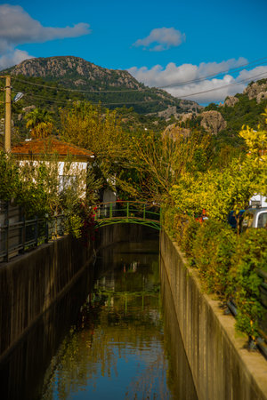 MARMARIS, MUGLA, TURKEY: Canal with water on the street of the city of Marmaris on a sunny day.のeditorial素材