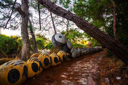 CAMYUVA, KEMER, TURKEY: Caterpillar sculpture in the park near the destroyed hotel Holiday Area Eco Dream Club Sea Resort in the village of Camyuva.のeditorial素材