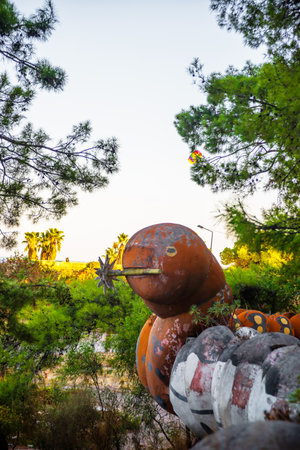 CAMYUVA, KEMER, TURKEY: Caterpillar sculpture in the park near the destroyed hotel Holiday Area Eco Dream Club Sea Resort in the village of Camyuva.のeditorial素材