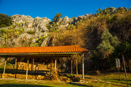 MARMARIS, TURKEY: The Archaeological Park of Iuilik or the Rocks of Well-Being is a unique open-air museum located on a hillside in the center of Marmaris on a blue sky background on a sunny day.のeditorial素材