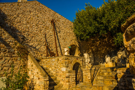 MARMARIS, MUGLA, TURKEY: Antique fragments of sculpture and anchor in the fortress Museum in Marmaris on a sunny day.のeditorial素材