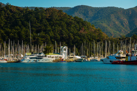 MARMARIS, MUGLA, TURKEY: Lighthouse and sailing yachts in the port of Marmaris on a sunny day.のeditorial素材