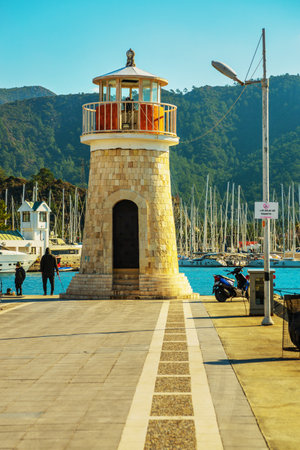 MARMARIS, MUGLA, TURKEY: Lighthouse and sailing yachts in the port of Marmaris on a sunny day.のeditorial素材