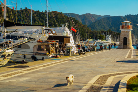 MARMARIS, MUGLA, TURKEY: Lighthouse and sailing yachts in the port of Marmaris on a sunny day.のeditorial素材