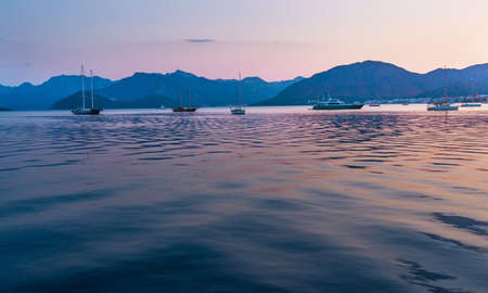 MARMARIS, MUGLA, TURKEY: Beautiful landscape with a view of the sea and mountains in the Turkish city of Marmaris at sunset.の写真素材