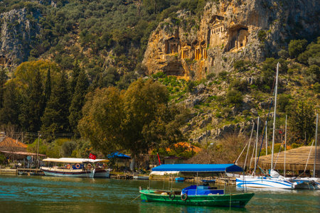 DALYAN, MUGLA, TURKEY: Tourist boats with excursions for tourists are moored to the promenade on the river Dalyan.のeditorial素材