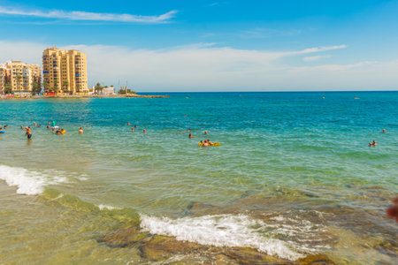 TORREVIEJA, SPAIN: The famous beach in Torrevieja on a sunny day in summer near Alicanteのeditorial素材