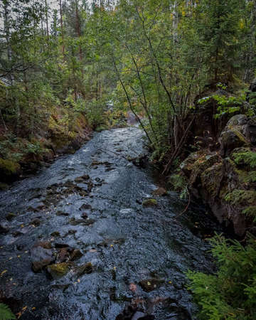 One river flows among the rocks at the bottom of the gorge.の写真素材
