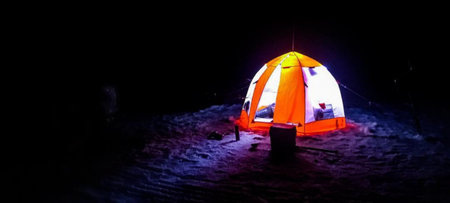 Night on the ice of a large lake.