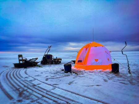 Fishing lodge on ice.の写真素材
