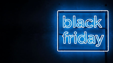 Neon black friday sign on a dark background with copy spaceの素材
