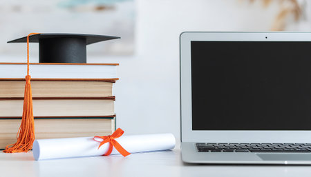 Close-up of graduation items on a table indoorsの素材
