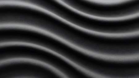 Close-up of a black fabric with wavy gray patterns and shadowsの素材