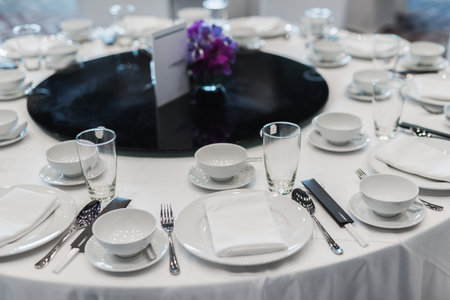 Elegant Banquet Table Setting with White Dinnerware