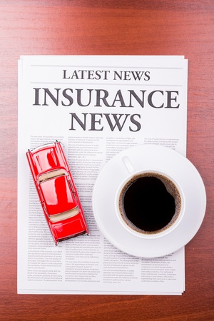 The newspaper LATEST NEWSwith the headline  INSURANCE NEWS and autoの写真素材