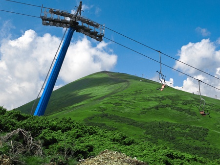 The high green hill and the aerial tramwayの写真素材