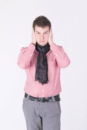 I can not hear. A man in a red shirtの写真素材