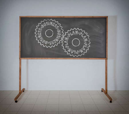 Gears with inscriptions on a school blackboardの写真素材
