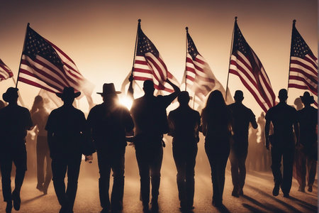 Silhouette of a group of people holding the american flag.の写真素材