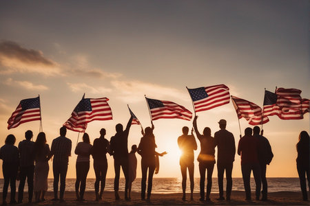 Group of diverse people holding american flags on the beach at sunsetの写真素材