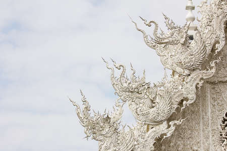 this is a white sculpture on a temple roofの写真素材