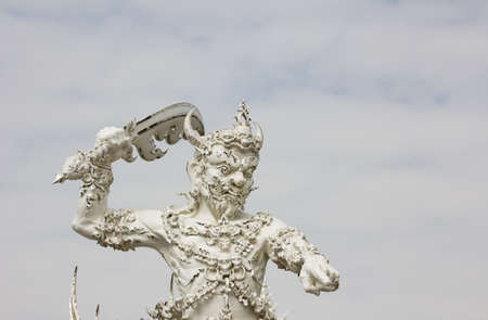 white sculpture of giant in Thai temple の写真素材