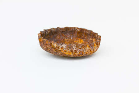 rusty bottle cap isolated on white backgroundの写真素材