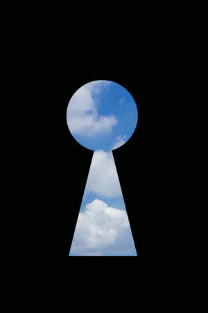 Sky in keyhole isolated on black backgroundの写真素材