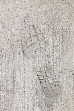 Man footprints on concrete track