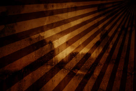 vintage abstract sun rays on the wall grunge.の写真素材