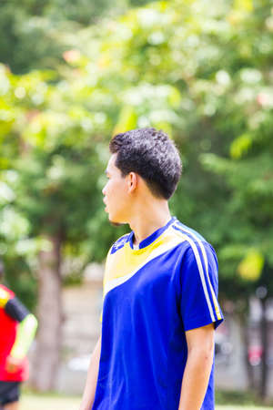 CHIANGRAI, THAILAND - AUG 9: unidentified male teenagers playing soccer in field on August 9, 2014...