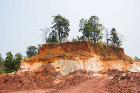 Layer of soil Front loader strips all side of a hill.の写真素材