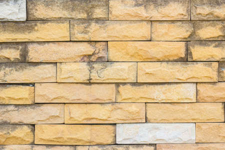 orange grunge brick wall background.の写真素材