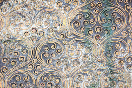 grunge golden spiral texture on the wall.の写真素材