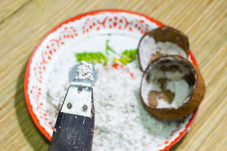 Old thai traditional coconut graterの写真素材