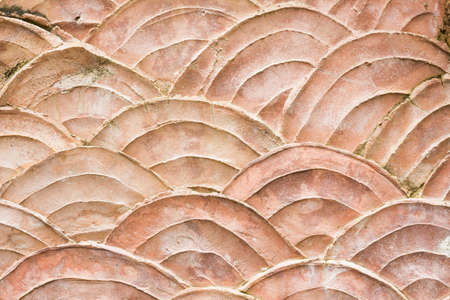close-up pattern of grungy wall shaped like scales of fish, backgroundの写真素材
