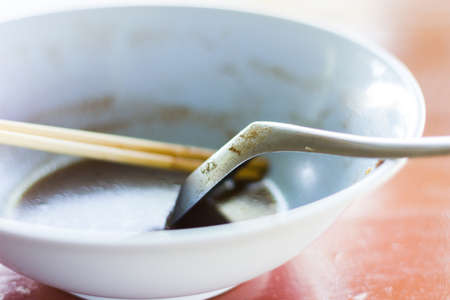 Empty bowl after eat and it's dirty./Empty bowl, shallow depth of field.の写真素材