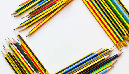 colorful pencils on the white paper, view from above.の写真素材