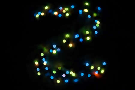 colorful letter Z made of blurred circular bokeh on black backgroundの写真素材