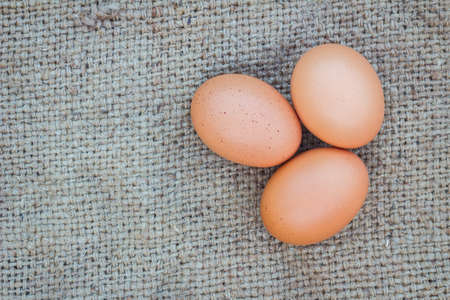 Close up of eggs on gunnysack for cook, with copyspaceの写真素材