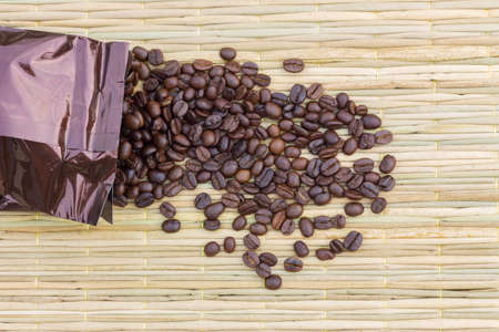 Coffee beans on the traditional mat, copyspace on the rightの写真素材