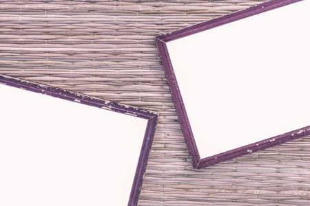 two wooden old black picture frame on traditional mat with white space in the middle, vintage styleの写真素材