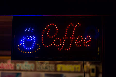 word coffee on advertising billboard in front of cafeの写真素材